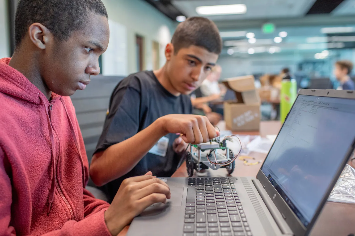Group of middle school students participate in a STEM learning activity
